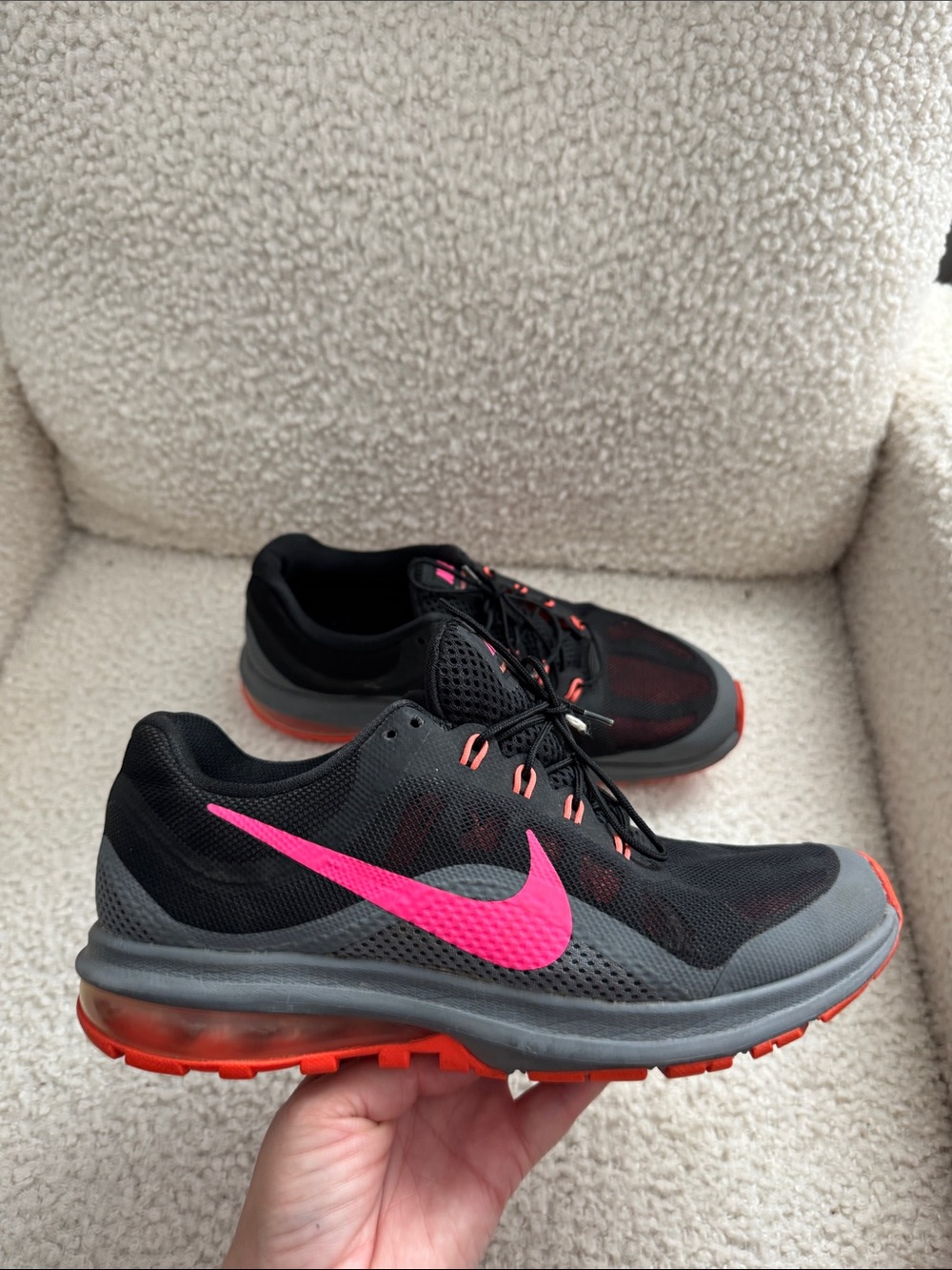 Nike Women’s Black Athletic Shoes with Pink Swoosh and Orange Accents